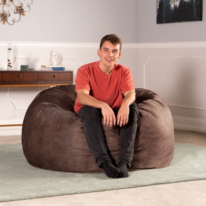 Man sitting on Saxx 4 wrangler chestunut