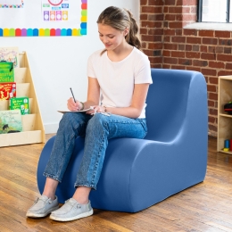 Child drawing while sitting on the Midtown Classroom Chair
