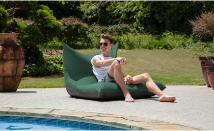 Man relaxing on the Finster Outdoor Bean Bag Lounge Chair - Sunbrella
