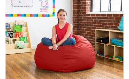 Girl on Gumdrop Large in Red in classroom