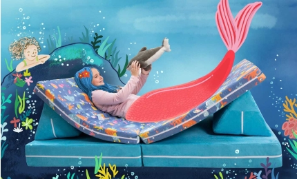 Child playing on Mermaid print Playscape Kids Play Couch