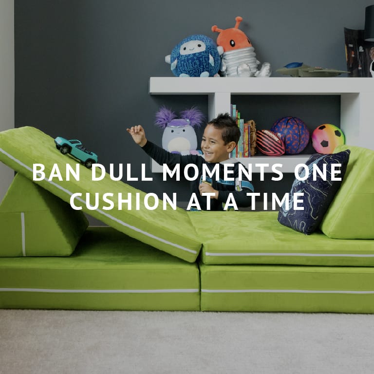 Ban Dull Moments One Cushion at a Time | Young child playing with the Zipline Playscape