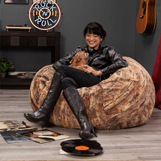 Woman relaxing in Jaxx Faux Fur Cocoon bean bag